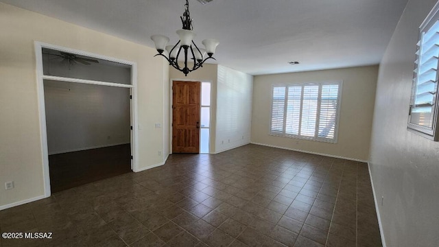 unfurnished dining area featuring an inviting chandelier