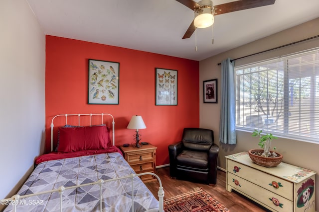 bedroom with hardwood / wood-style flooring and ceiling fan