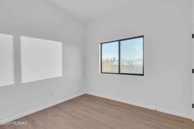 spare room featuring light hardwood / wood-style flooring