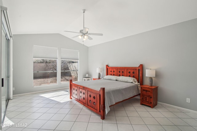 bedroom featuring light tile patterned floors, vaulted ceiling, and ceiling fan