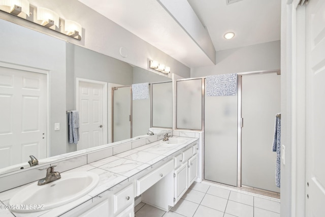 bathroom with an enclosed shower, vanity, and tile patterned floors