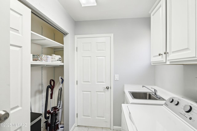 laundry room with cabinets and sink