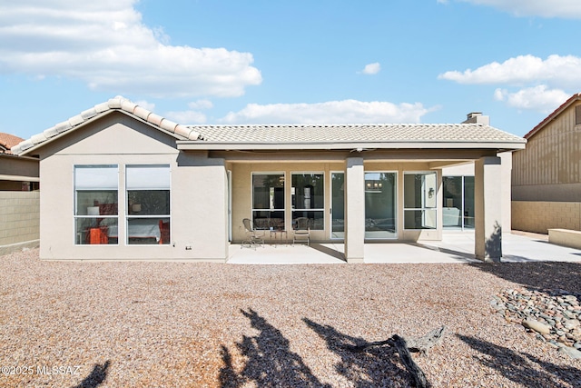 back of house with a patio area