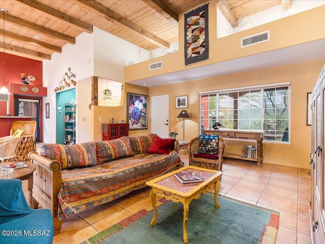 living room with light tile patterned flooring, beam ceiling, high vaulted ceiling, and wooden ceiling