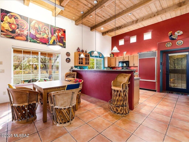 interior space featuring pendant lighting, light tile patterned floors, wooden ceiling, and beamed ceiling