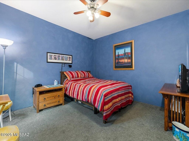 bedroom with ceiling fan and carpet flooring