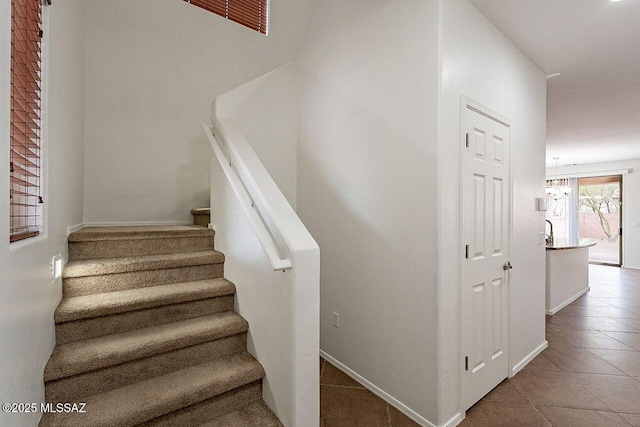 stairway with tile patterned flooring