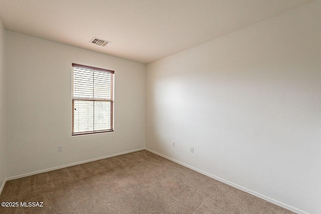 unfurnished room featuring carpet floors