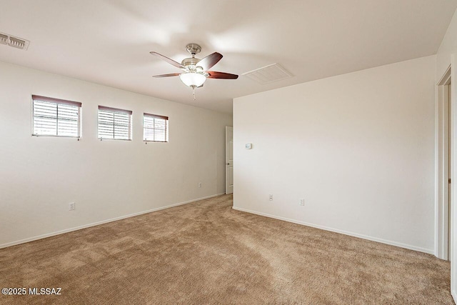 carpeted empty room with ceiling fan