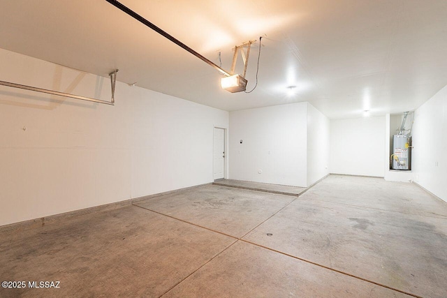 garage featuring gas water heater and a garage door opener