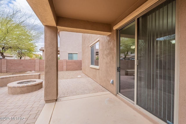 view of patio / terrace featuring an outdoor fire pit