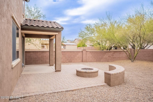 view of patio / terrace featuring a fire pit