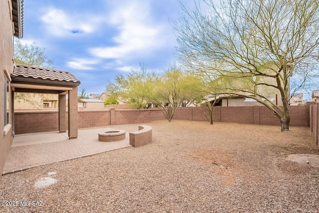 view of yard with a patio area and a fire pit