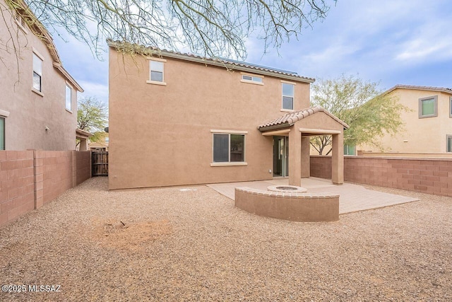 back of house featuring a patio