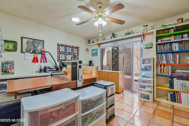 office featuring ceiling fan, a textured ceiling, and light tile patterned floors