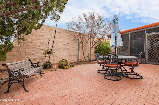 view of patio with a sunroom