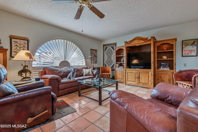 tiled living room featuring a textured ceiling and ceiling fan