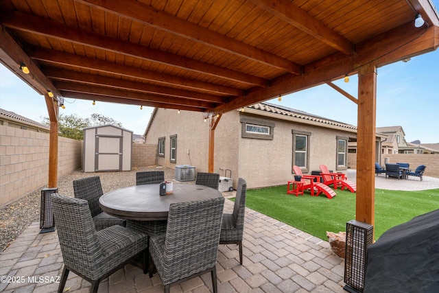 view of patio with a storage shed and a playground