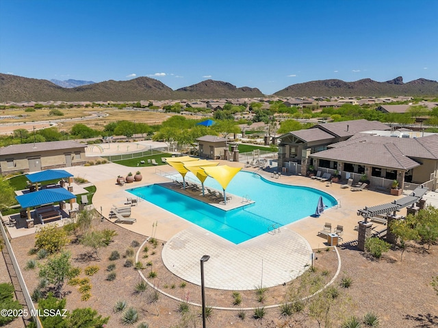 view of pool featuring a patio and a mountain view