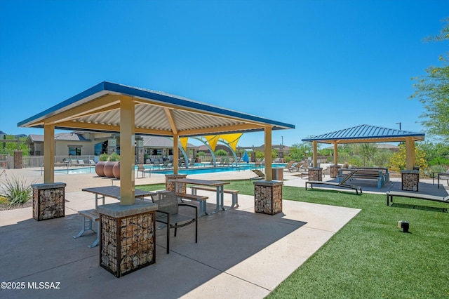 surrounding community with a pool, a gazebo, a patio, and a yard