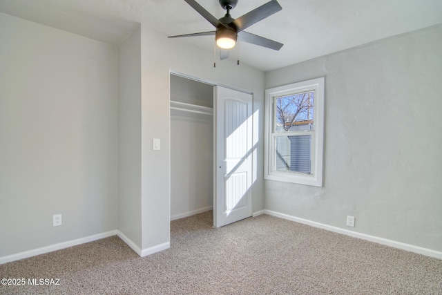 unfurnished bedroom with ceiling fan, carpet floors, and a closet