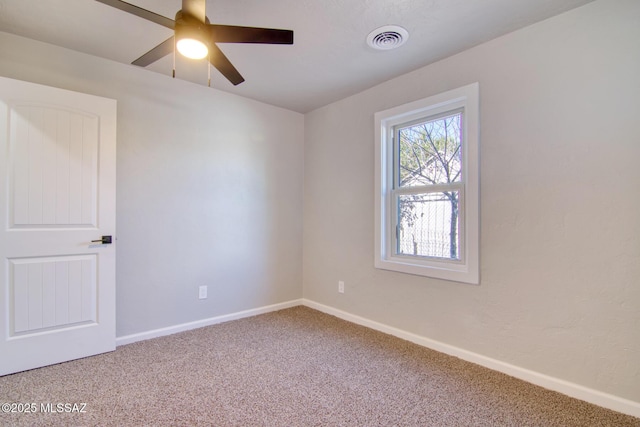 empty room featuring carpet and ceiling fan