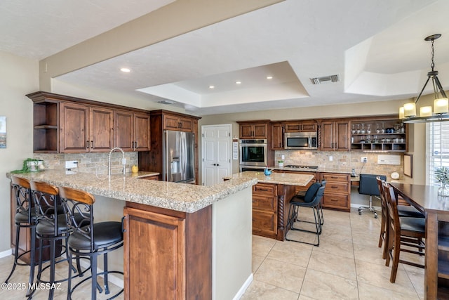 1943 W Desert Highlands Dr, Oro Valley, AZ 85737 - kitchen featuring open shelves, stainless steel appliances, a raised ceiling, tasteful backsplash, and recessed lighting