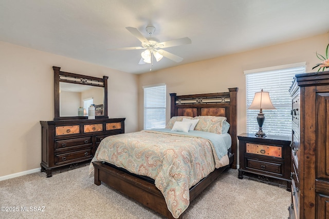 1943 W Desert Highlands Dr, Oro Valley, AZ 85737 - bedroom with light colored carpet, baseboards, and a ceiling fan