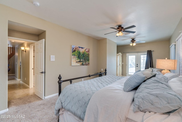 1943 W Desert Highlands Dr, Oro Valley, AZ 85737 - bedroom with french doors, access to exterior, light colored carpet, baseboards, and a ceiling fan