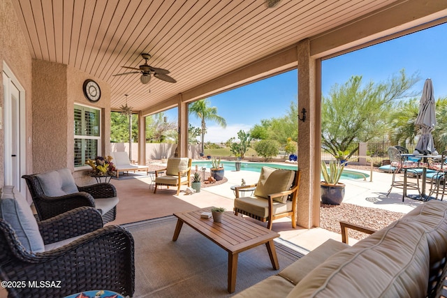 1943 W Desert Highlands Dr, Oro Valley, AZ 85737 - fenced backyard with an outdoor hangout area, a ceiling fan, and a patio