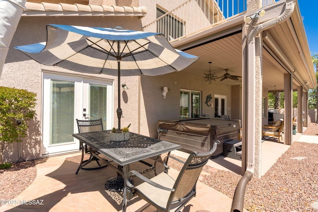 1943 W Desert Highlands Dr, Oro Valley, AZ 85737 - view of patio featuring a hot tub, outdoor dining area, a ceiling fan, and french doors