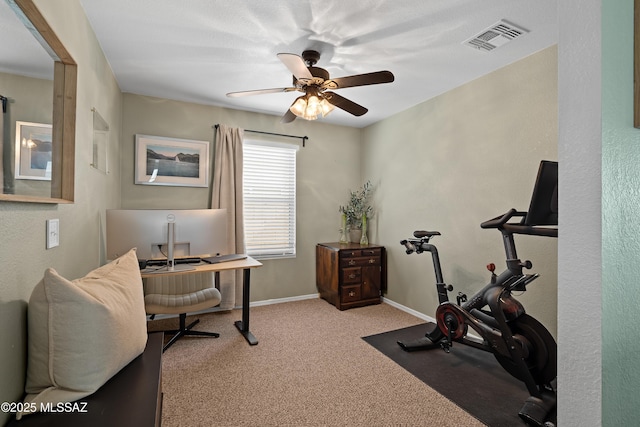 home office featuring light colored carpet and ceiling fan