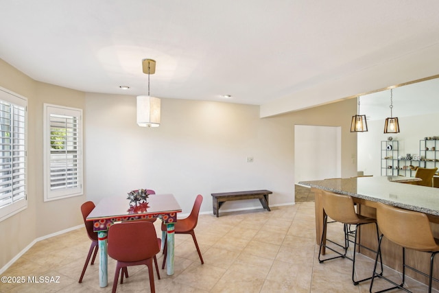 dining space featuring light tile patterned floors