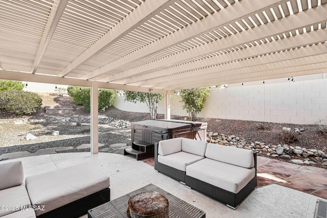 view of patio with an outdoor living space and a hot tub