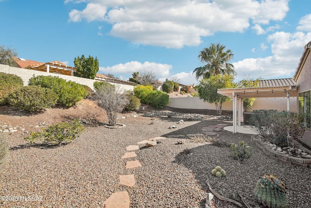 view of yard with a pergola and a patio area