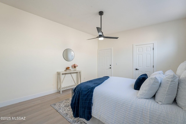 bedroom featuring ceiling fan and light wood-type flooring