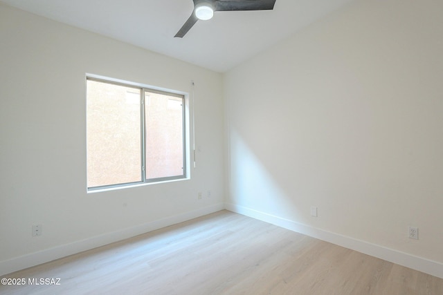 spare room with light hardwood / wood-style flooring and ceiling fan