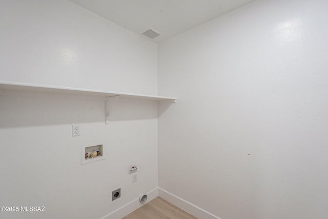 washroom with washer hookup, light wood-type flooring, and electric dryer hookup