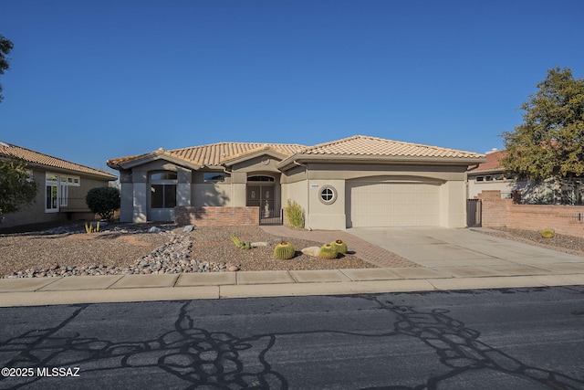 mediterranean / spanish-style house featuring a garage