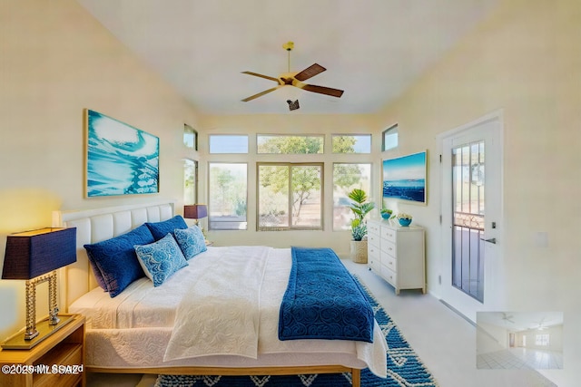 bedroom featuring multiple windows and ceiling fan