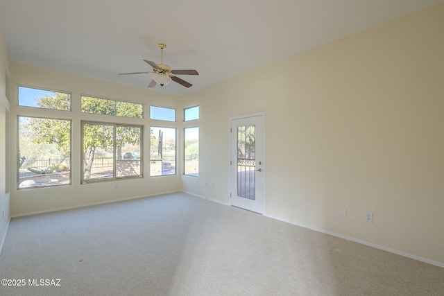 carpeted empty room with ceiling fan