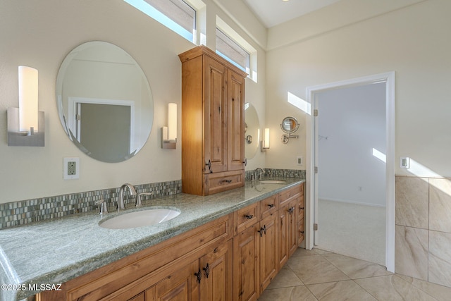 bathroom with tile patterned flooring and vanity