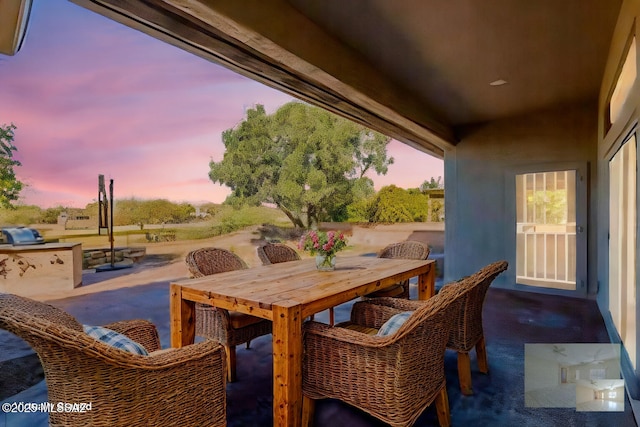 view of patio terrace at dusk