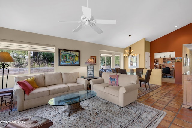 tiled living room with ceiling fan with notable chandelier and high vaulted ceiling