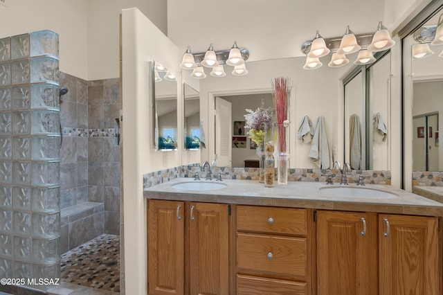 bathroom featuring vanity and a tile shower