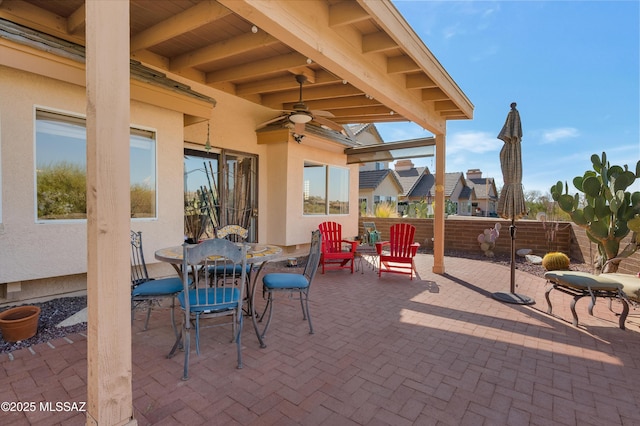 view of patio featuring ceiling fan