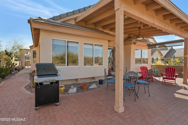 view of patio / terrace with ceiling fan and grilling area