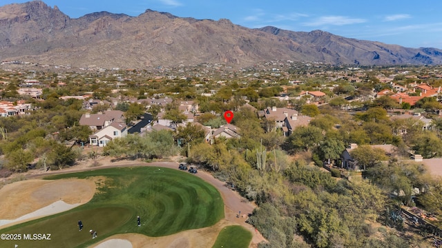 birds eye view of property with a mountain view