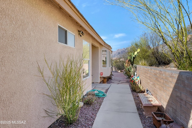 view of side of property featuring a patio area