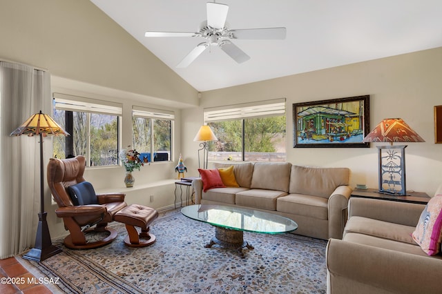 living room featuring ceiling fan, tile patterned flooring, and vaulted ceiling